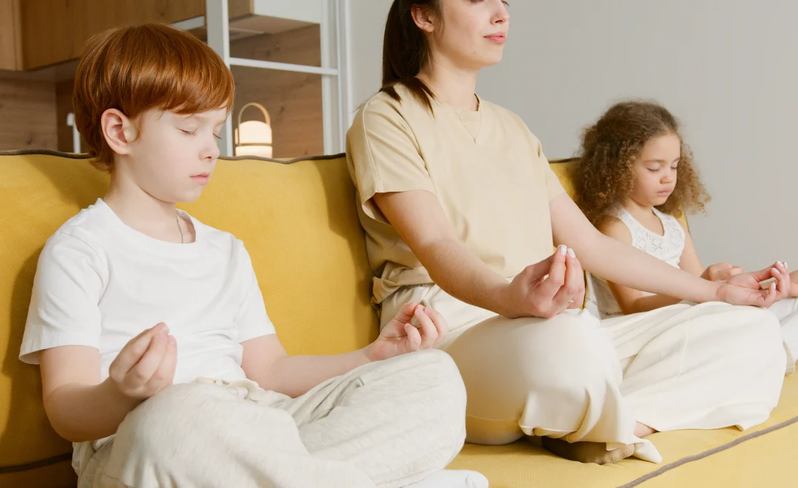 family meditating in the living room
