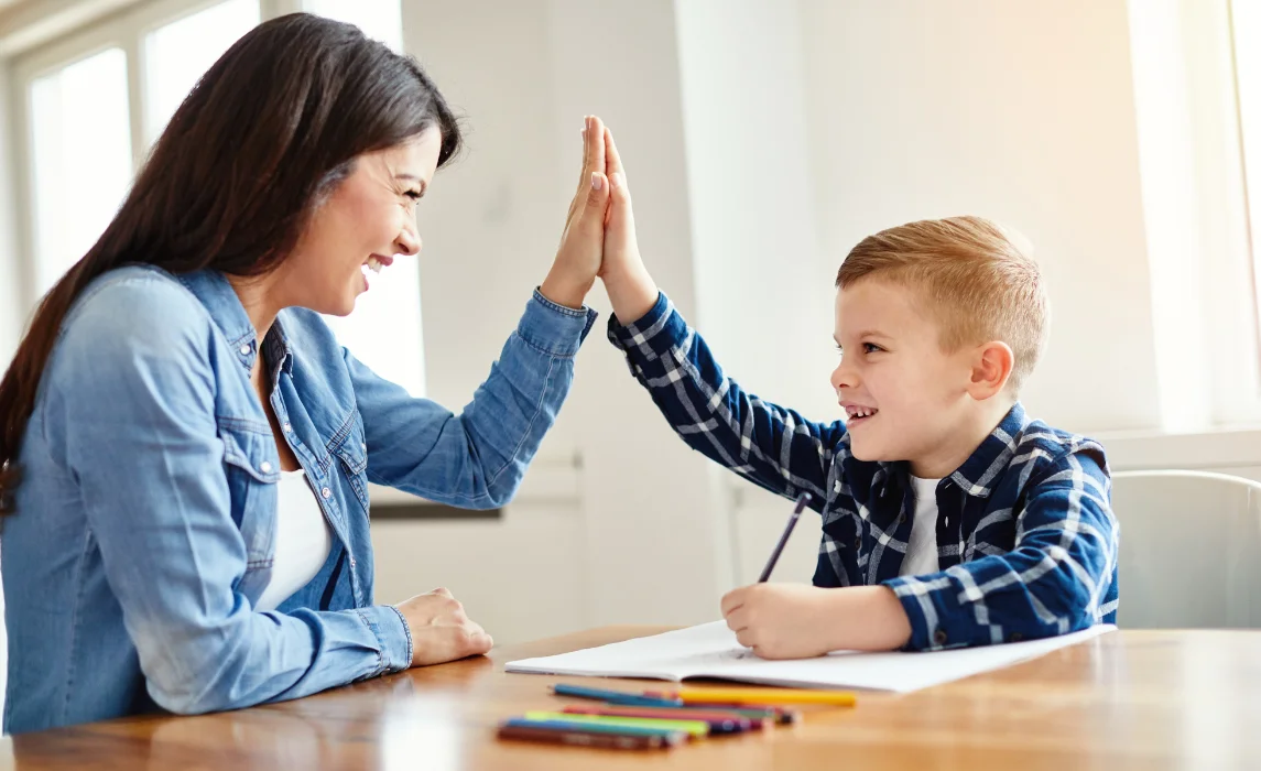 kid and his teaching doing high five