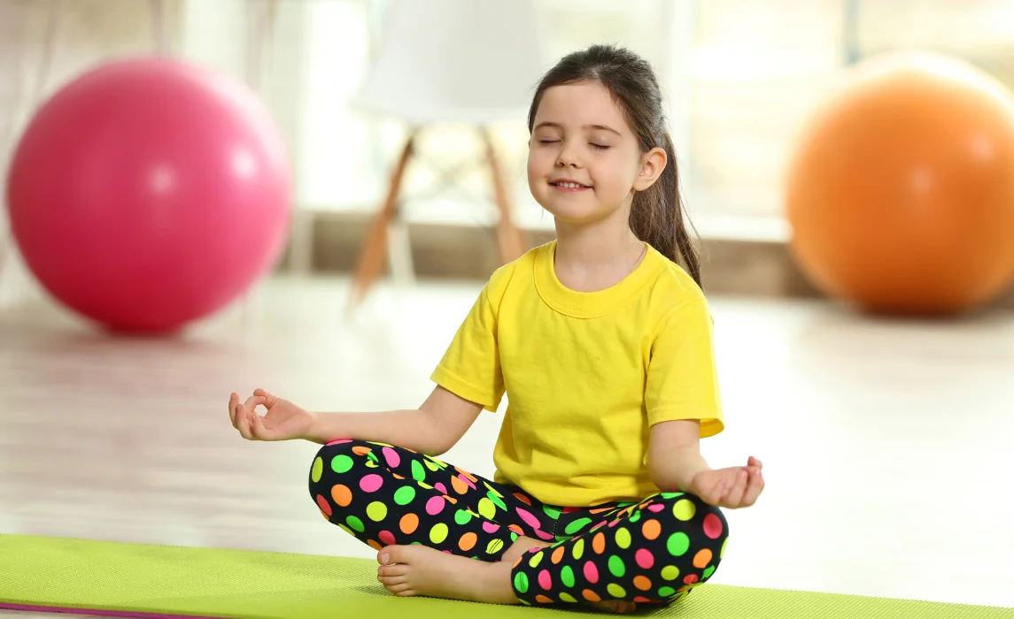 kid doing a yoga exercise