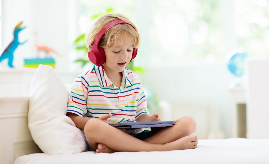 kid listening to an ipad