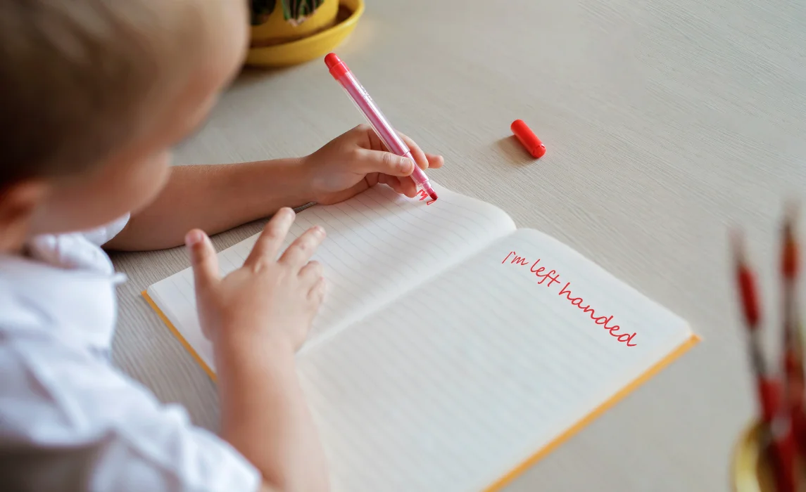 kid writing in the notebook