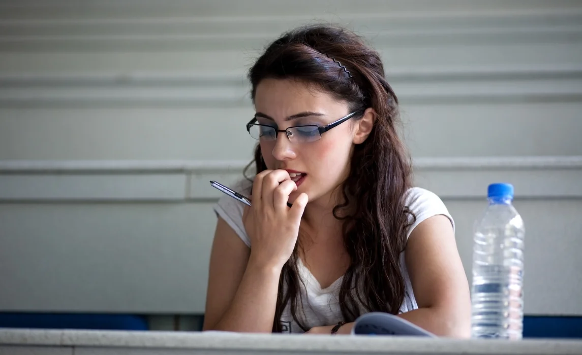 girl nervously biting her nails