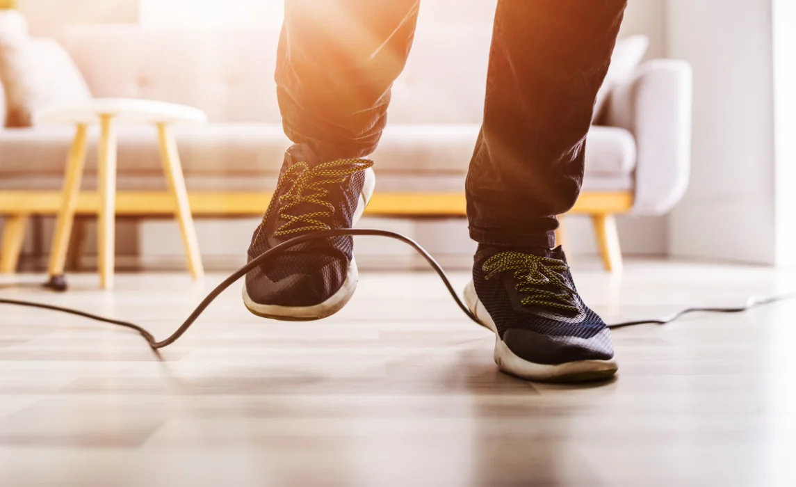 feet tripping over a wire