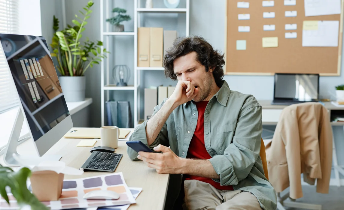 guy yawning in the office