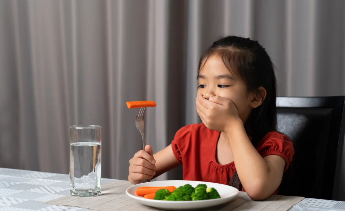 kid being disgusted in carrots