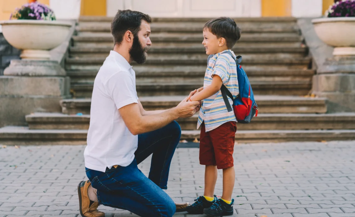 kid happily listening to his dad