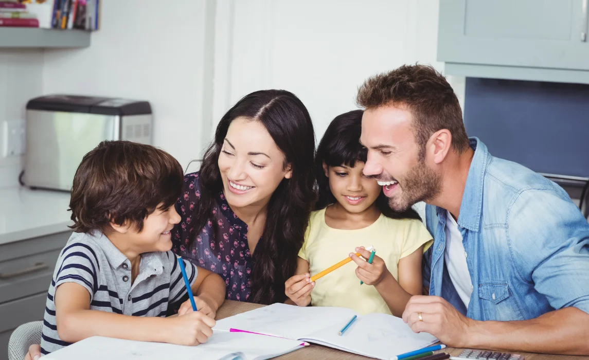 family teaching their kids to write