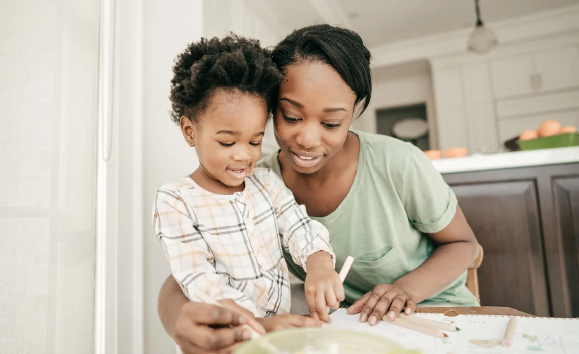 kid listening to his mother in the kitchen