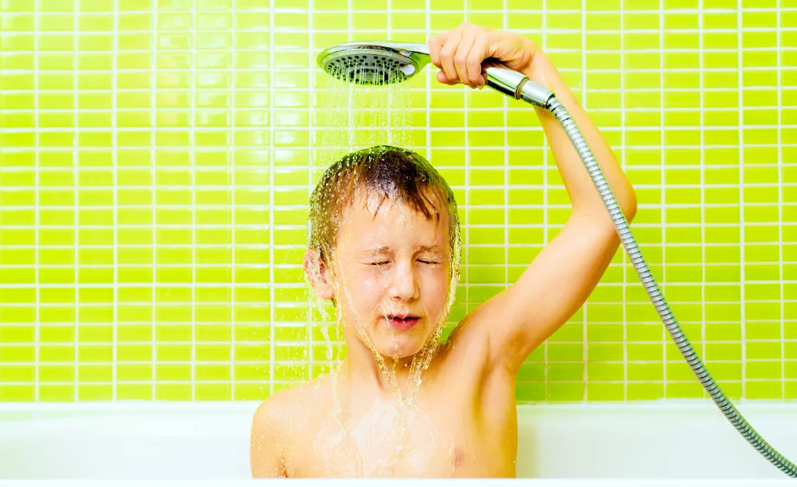 teen showering in a green bathroom