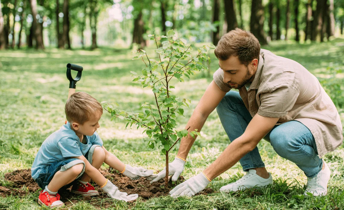 father and son planting