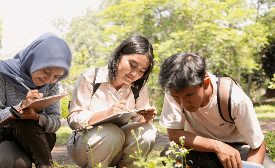 people inspecting plants