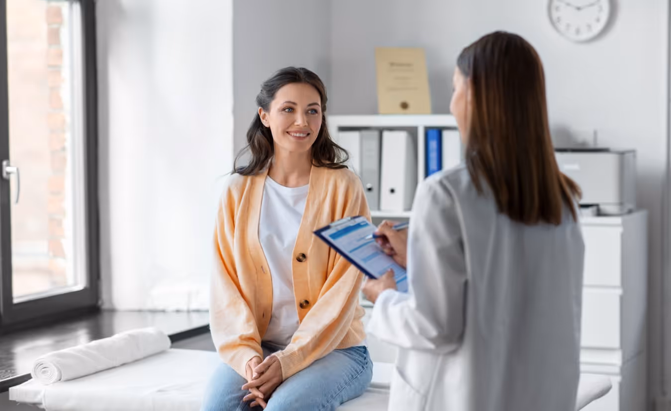 Smiling patient with allergy specialist in a clean Virginia Beach clinic setting