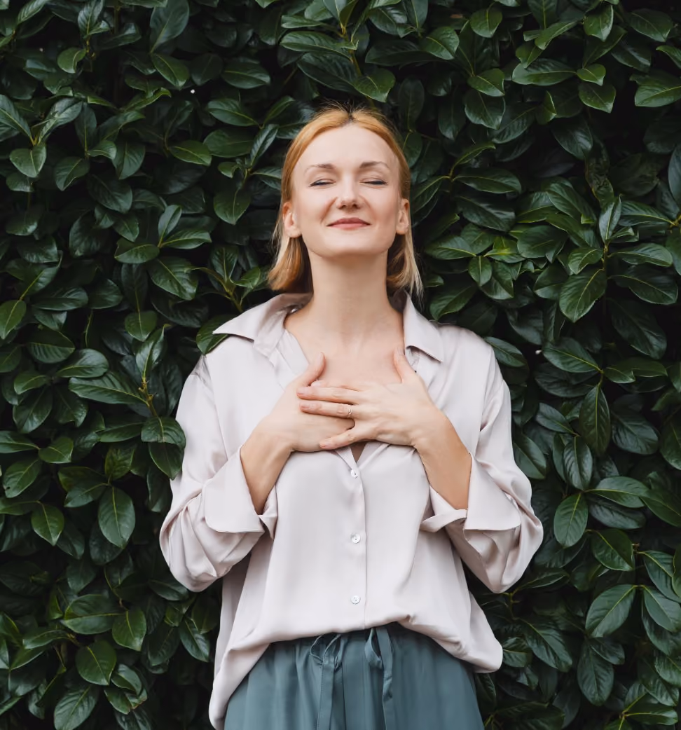 Woman taking in a deep breath through both sides of her nose