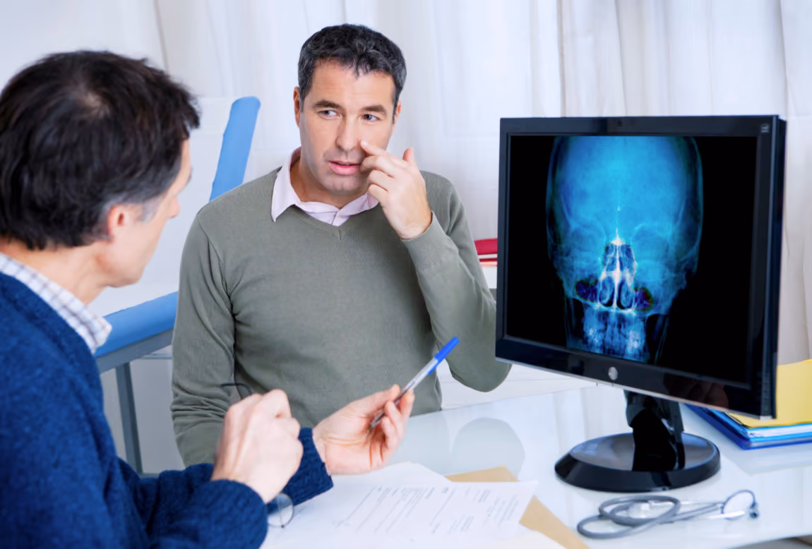 Patient consulting with an ENT provider about nasal airway obstruction