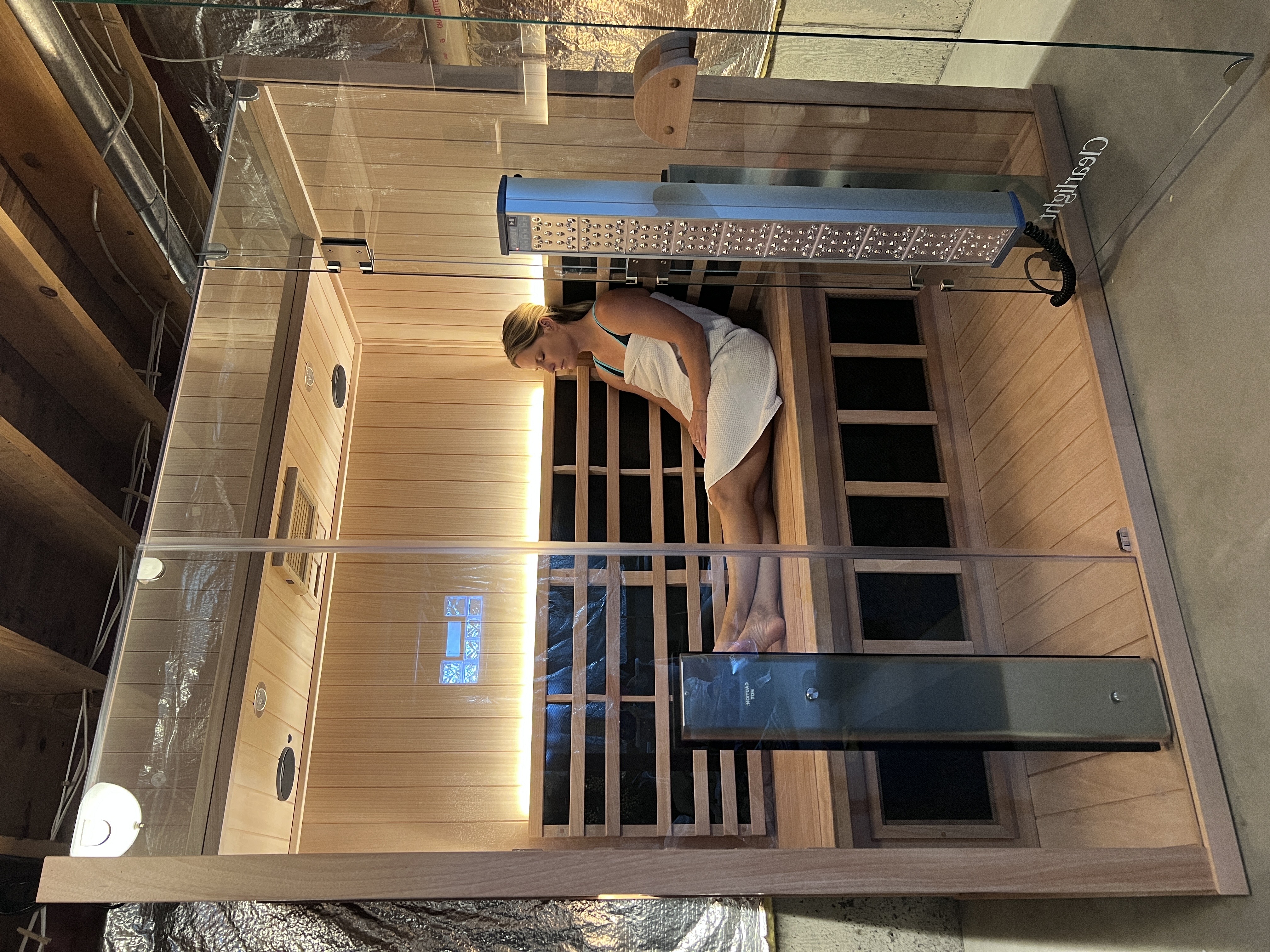 Dr. Gretchen Hawley relaxing in her at-home Clearlight sauna