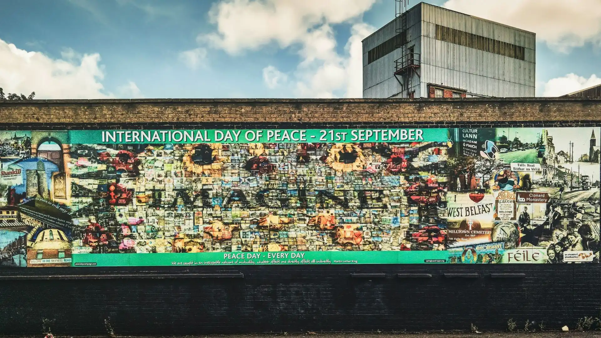 A mural for Peace Day on the “Peace Wall” in West Belfast