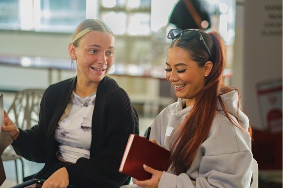 Two girls talking and laughing