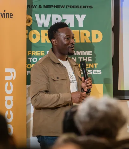 man holding microphone and speaking