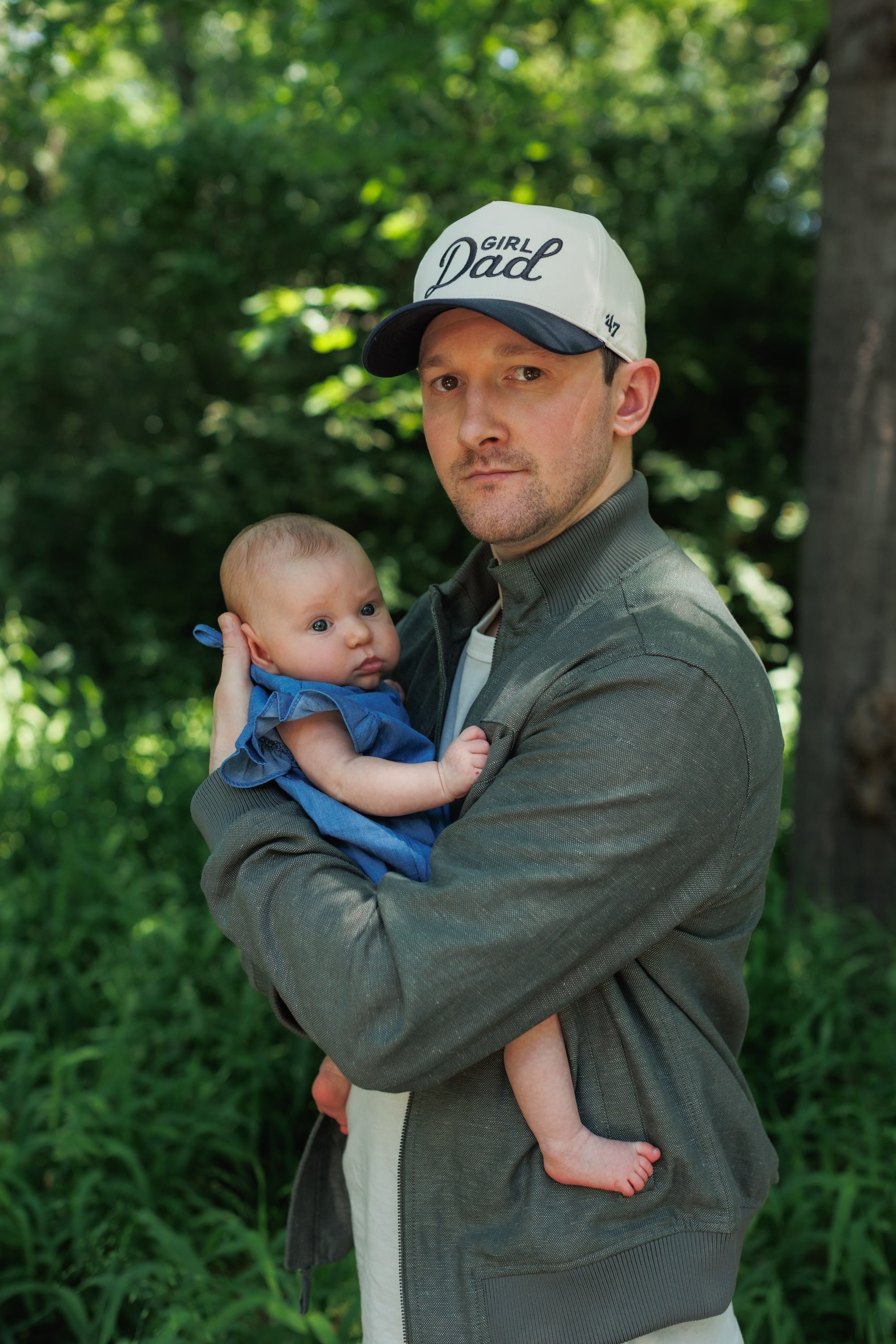 Keeton Storts holding his daughter Nora Hayes Storts during an outdoor family portrait session
