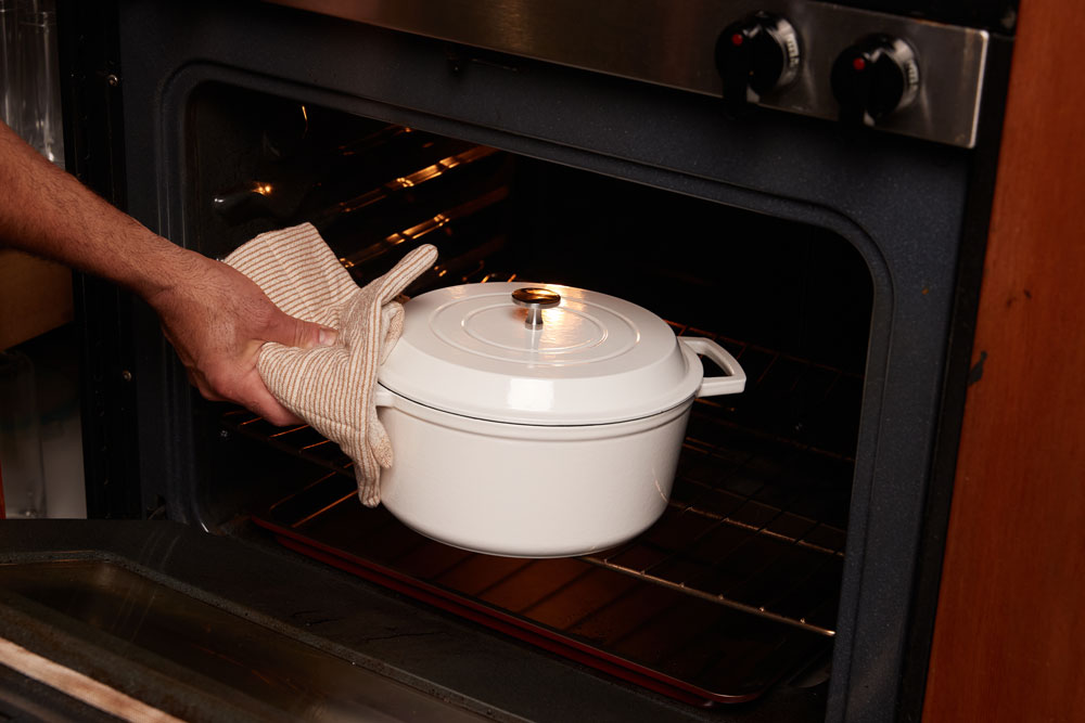 Taking out the dutch oven and removing the lid