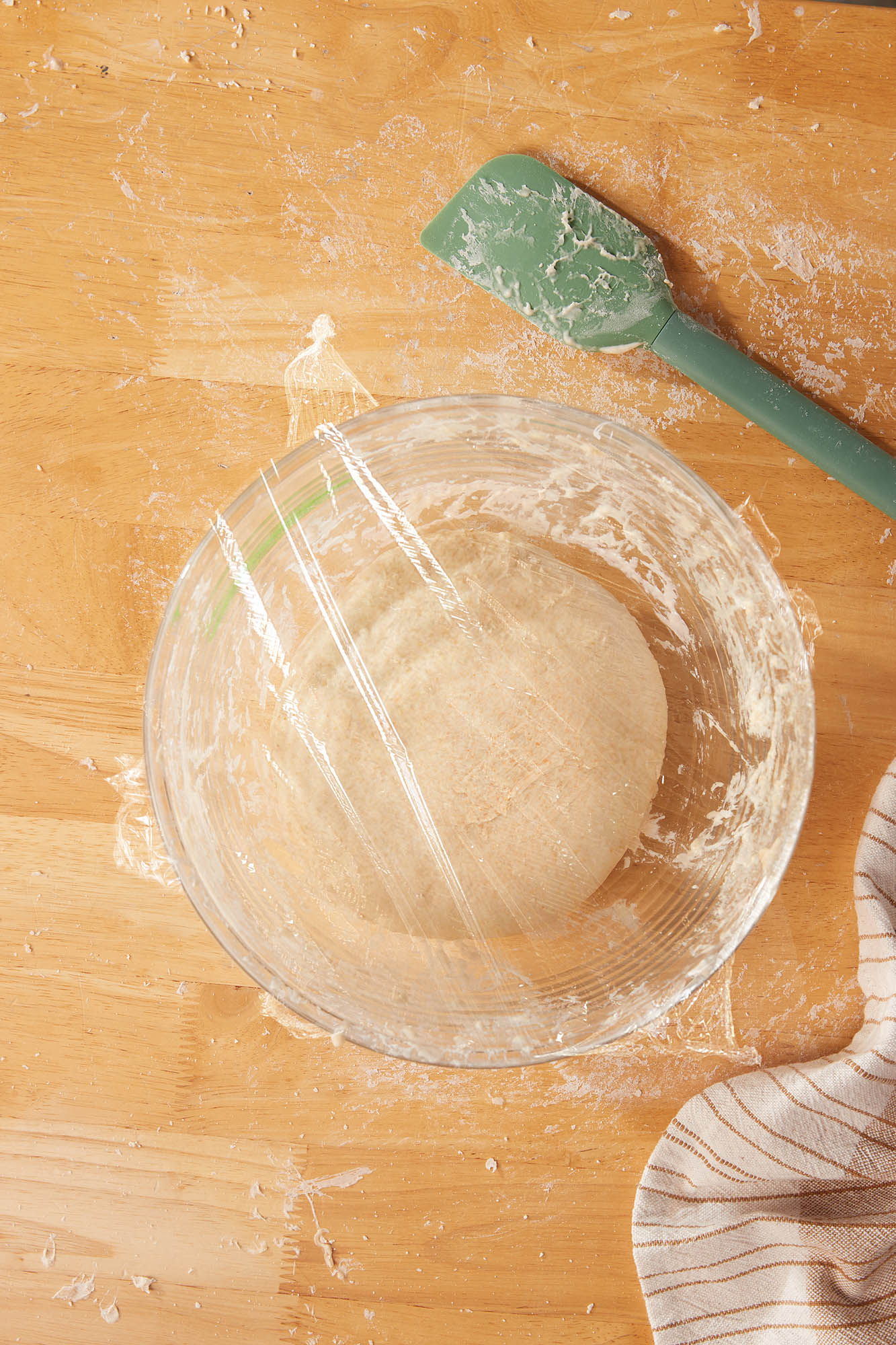 Covered dough in a rising container