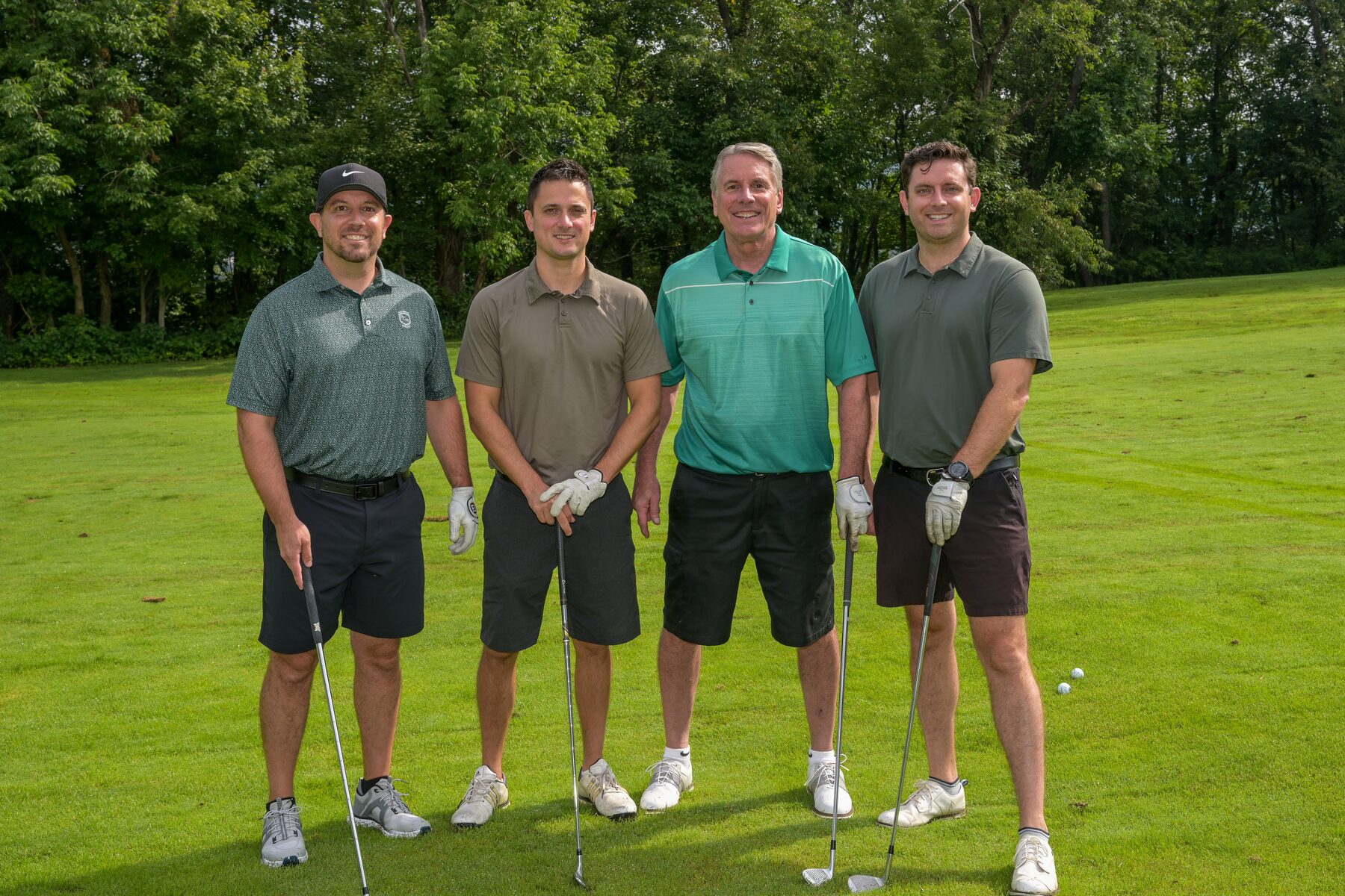 A foursome poses on the tee at the 30th Annual BCCHA Golf Outing at Beaver Valley Golf Club