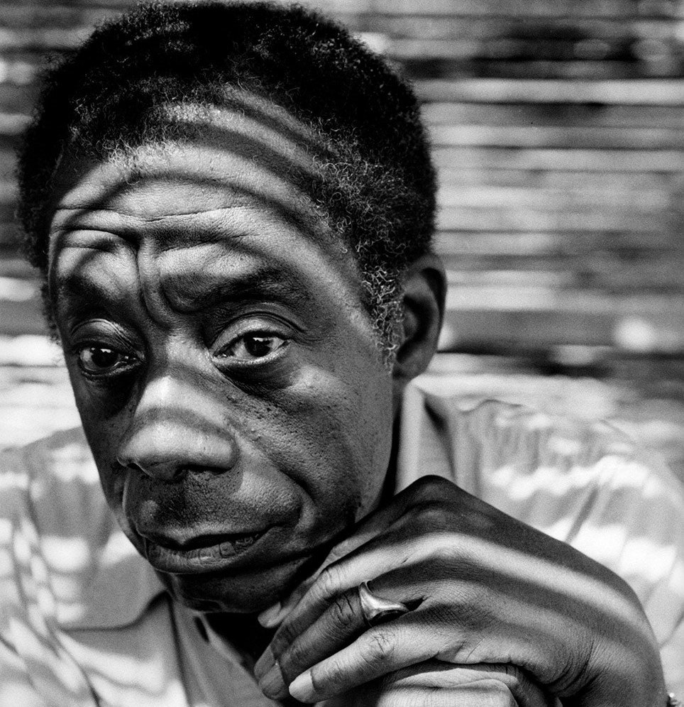 Black and white photo of James Baldwin