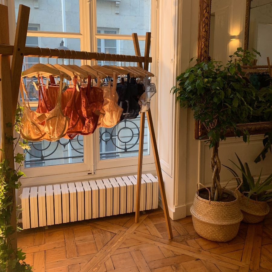 A picture of bras hanging on a rack