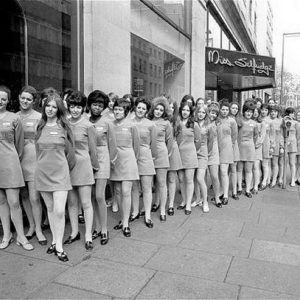 A black and white photo of sales women in front of Miss Selfridge's