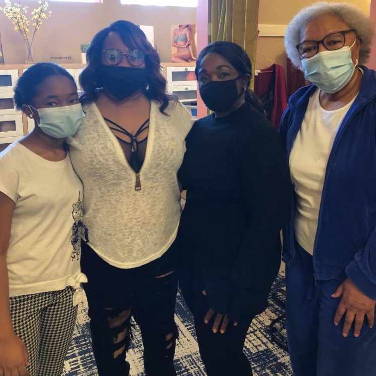 A photo of four women in masks
