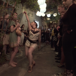 A woman dancing with other women
