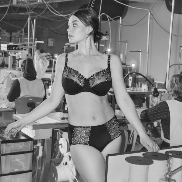 A black and white photo of a model in a PrimaDonna bra