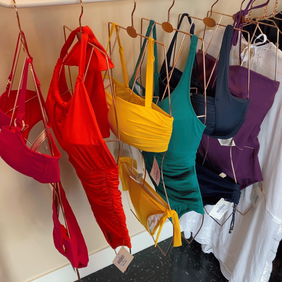A rack with colorful swimsuits