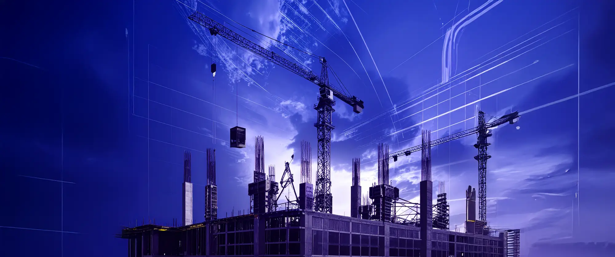 Construction site silhouette against dark blue sky