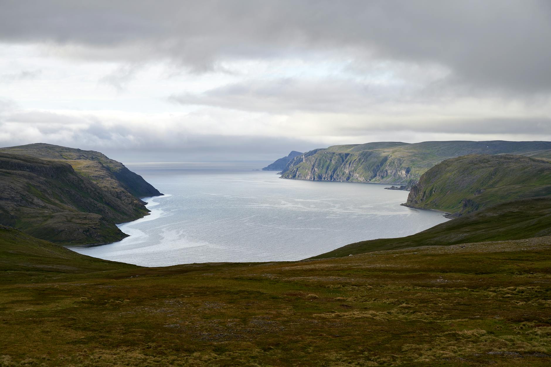 Breathtaking aerial view of Nordkapp cliffs and coastline in Norway, capturing dramatic landscape.