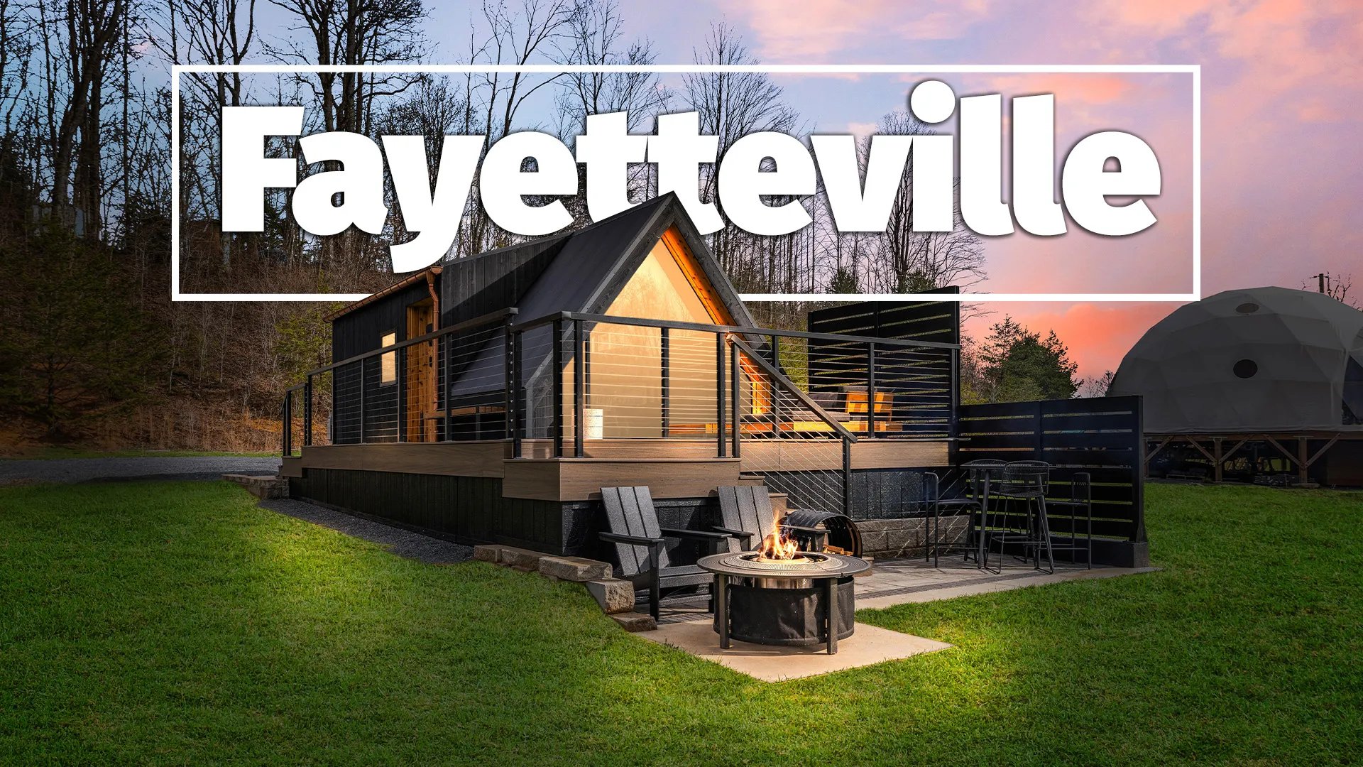 Modern Fayetteville cabin at sunset with firepit, deck, and bare trees
