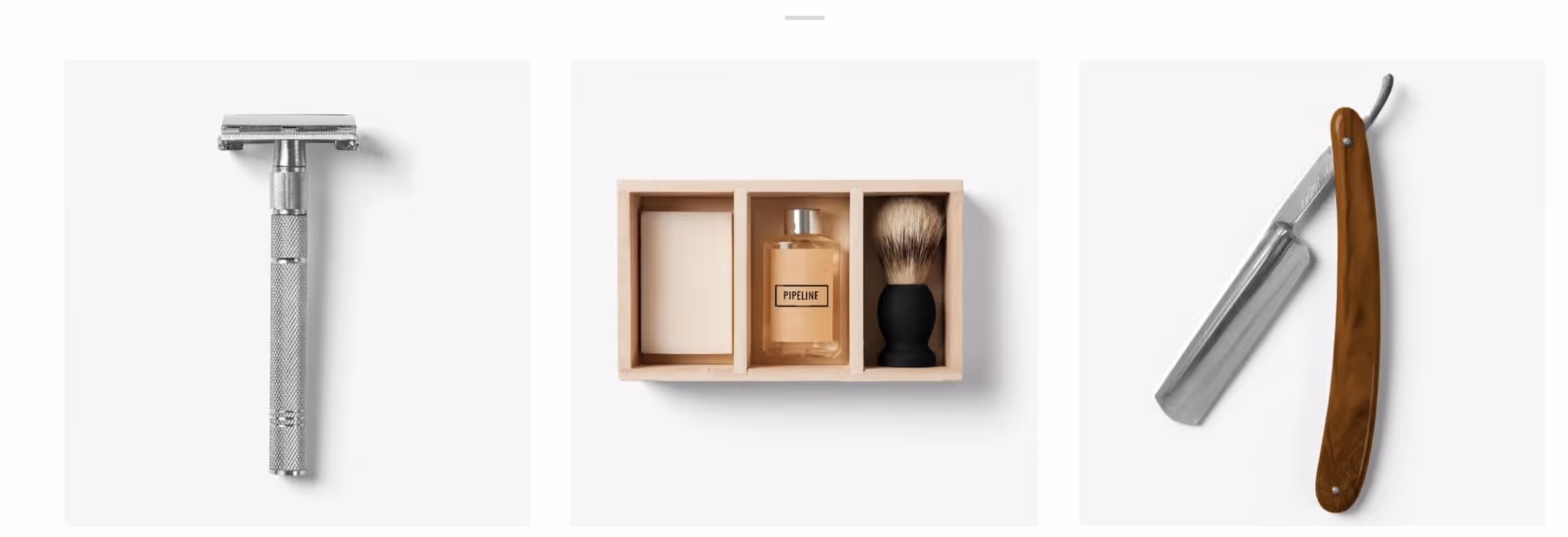 Set of three shaving items: safety razor, boxed shaving kit with soap, brush, and straight razor with wooden handle.