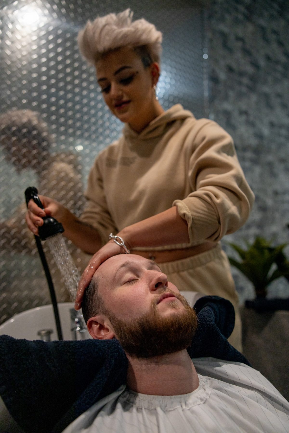 Taylor Leven washes hair