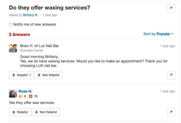 Yelp Q&A showing two answers confirming waxing services are offered at Lux Nail Bar.