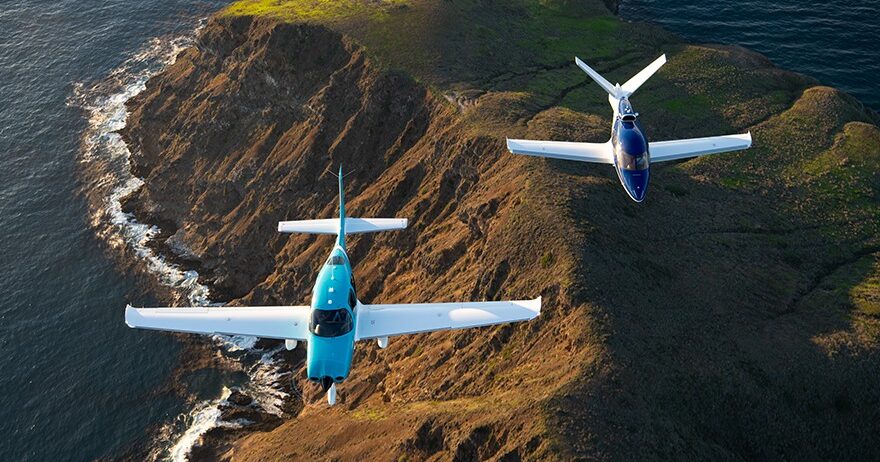 Two Cirrus Aircraft flying together