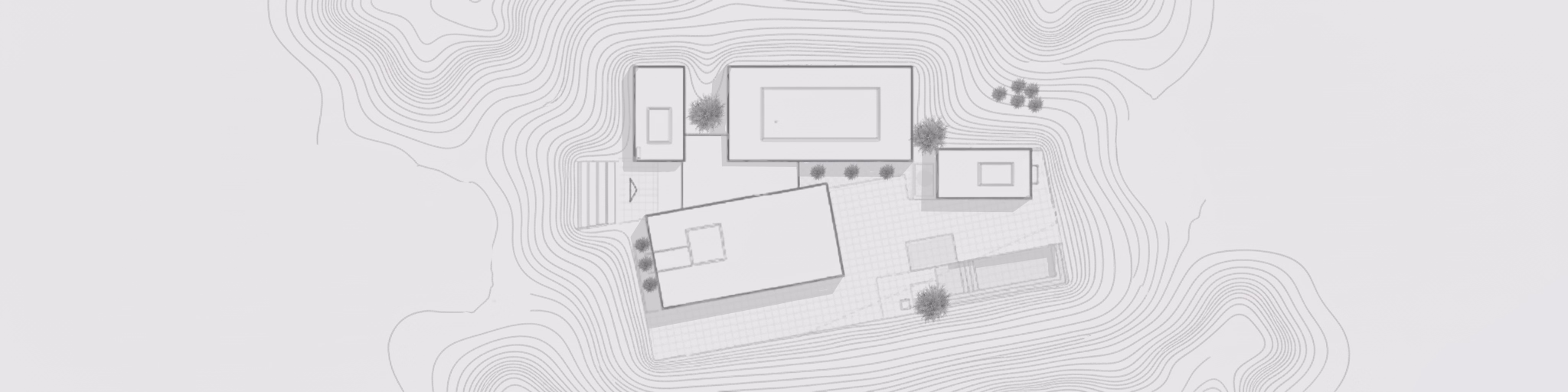 Architectural site plan showing a building complex with four rectangular structures surrounded by contour lines and several small trees.