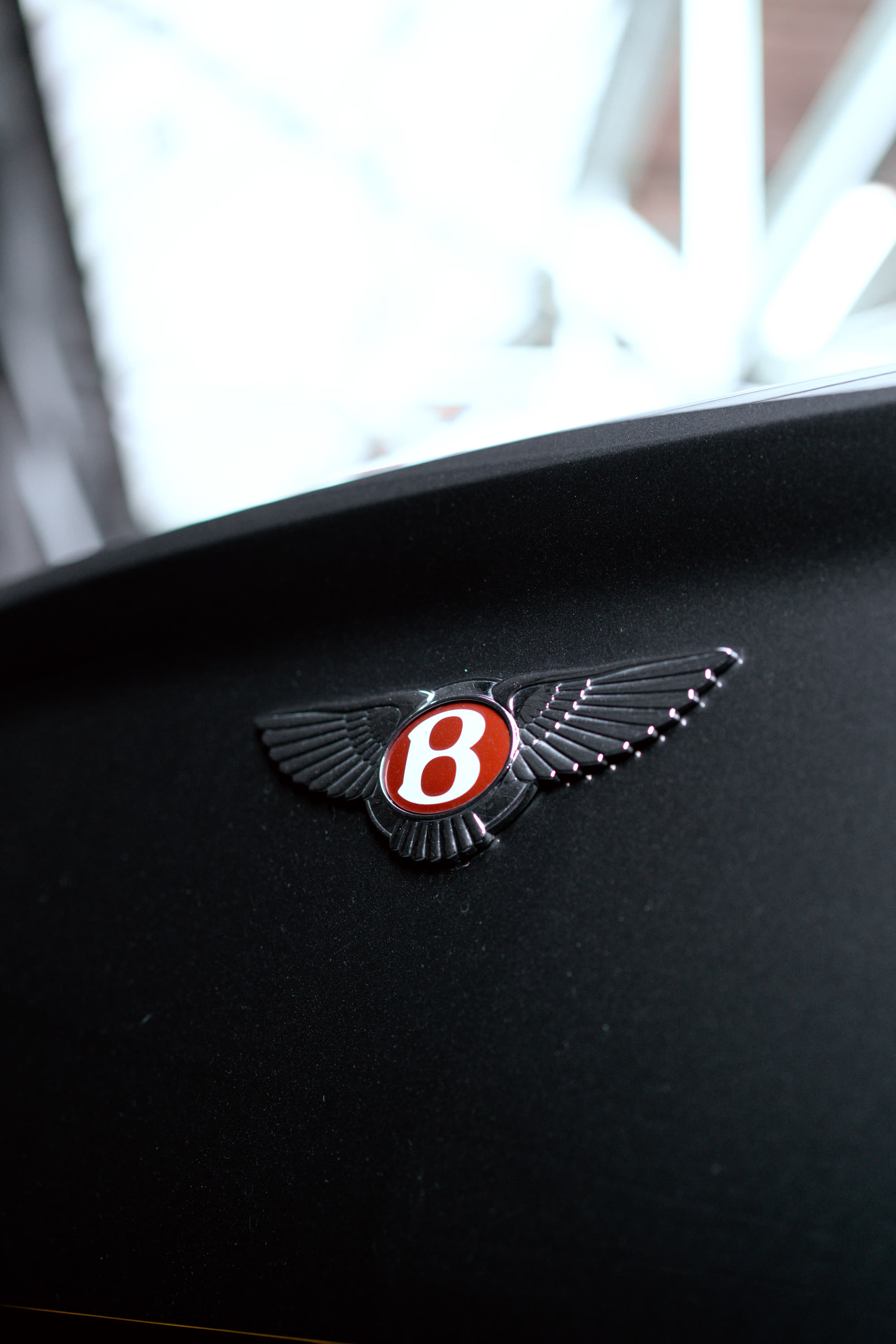 Bentley badge detail shot for TCC Luxe