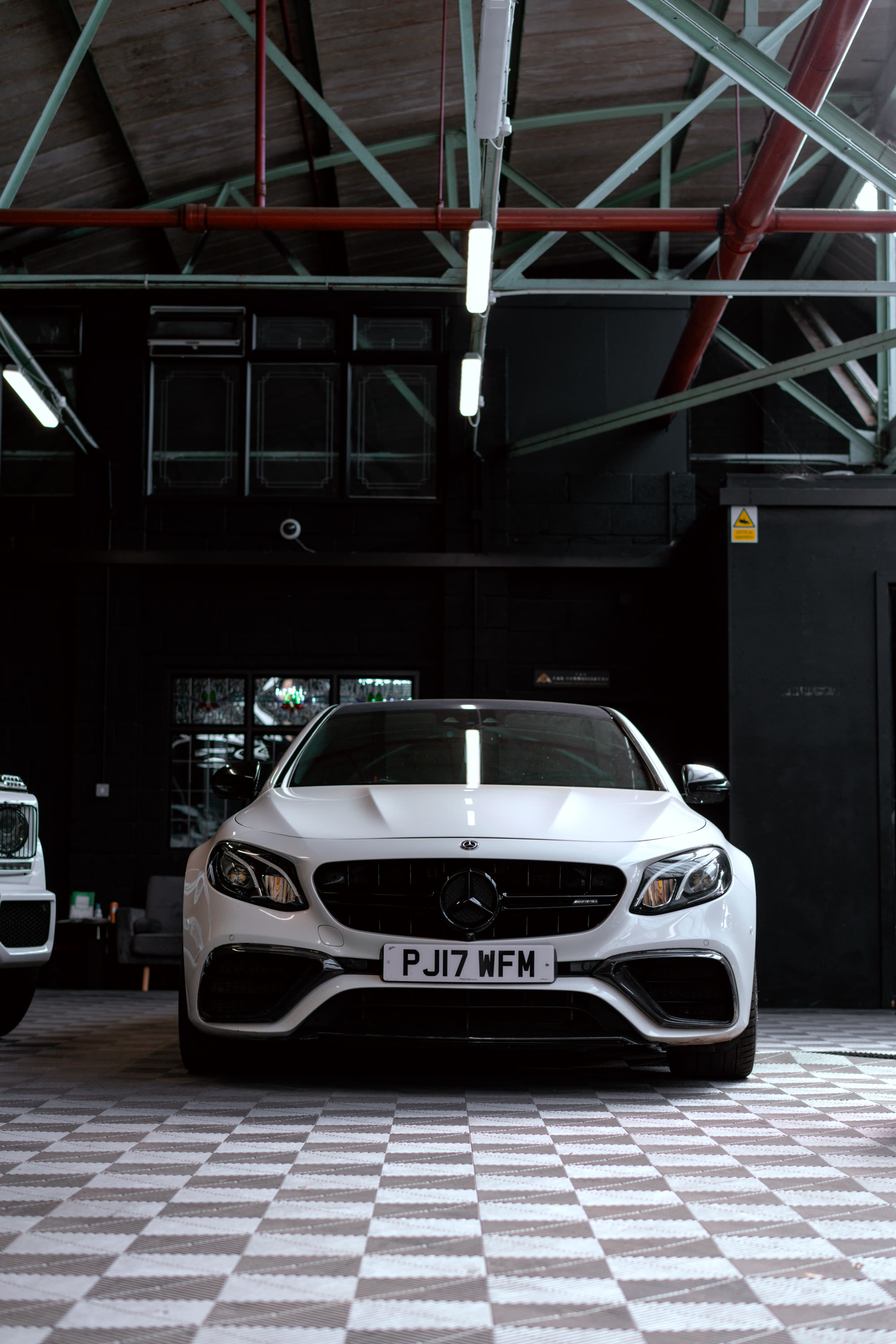 White Mercedes E63 AMG photographed head on for TCC Luxe