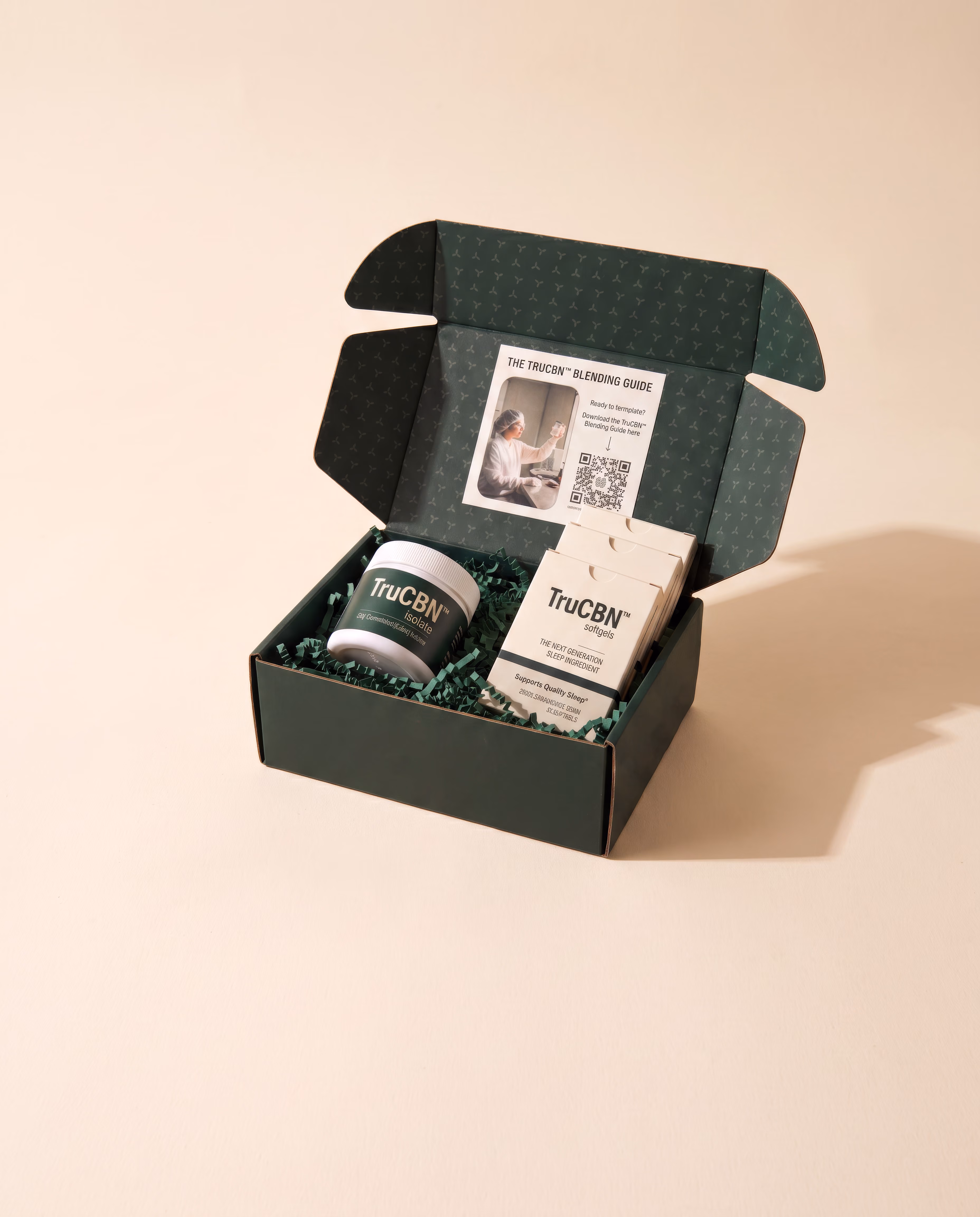 TruCBN™ sample kit: isolate jar, softgel cartons, and the TruCBN™ Blending Guide in a dark green mailer box