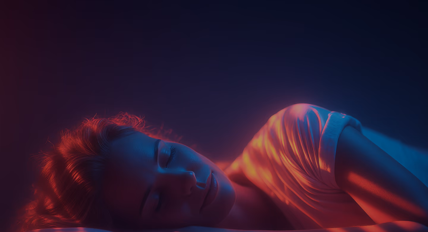 Woman sleeping peacefully under soft colored light