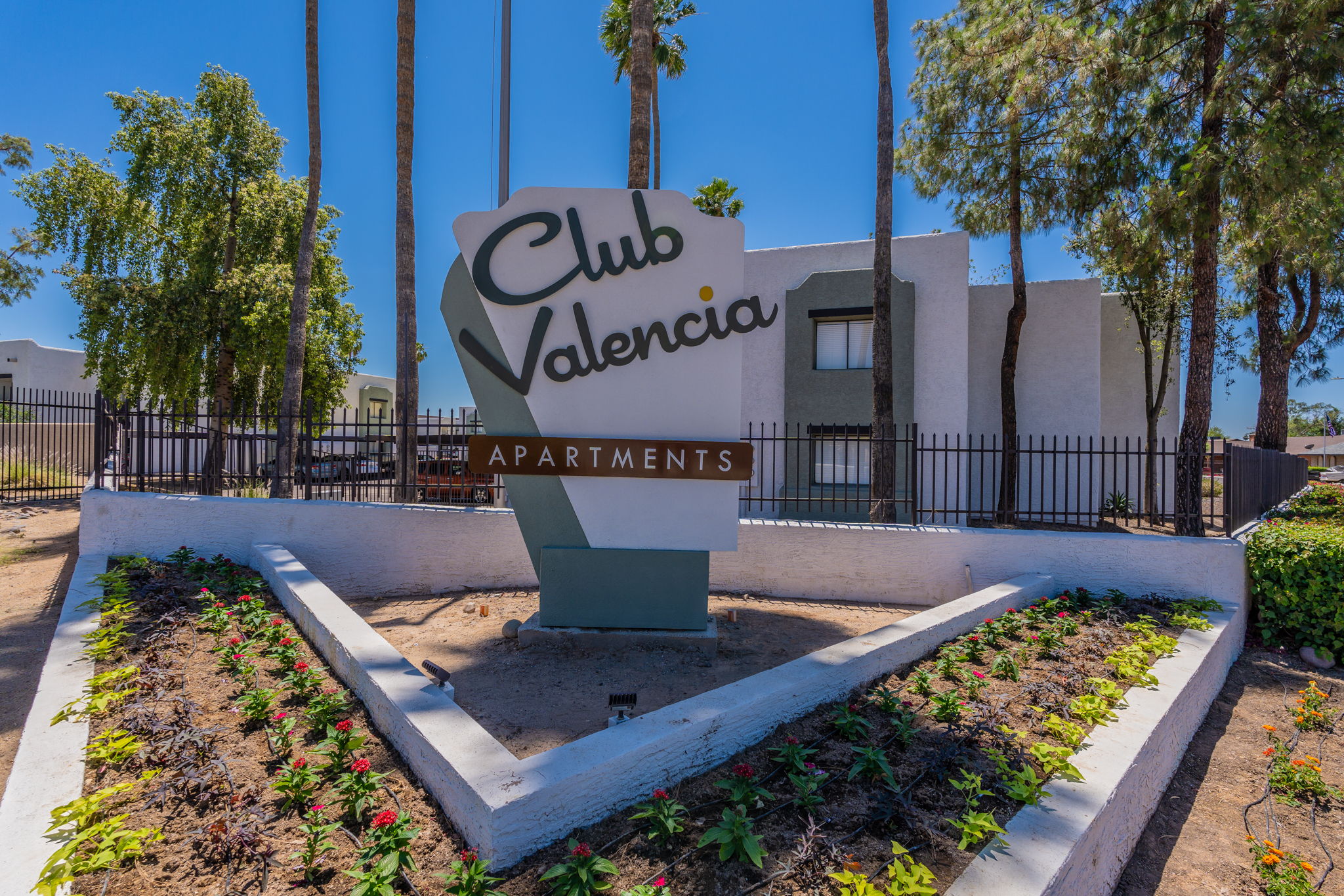 Club Valencia entrance monument and apartment buildings.