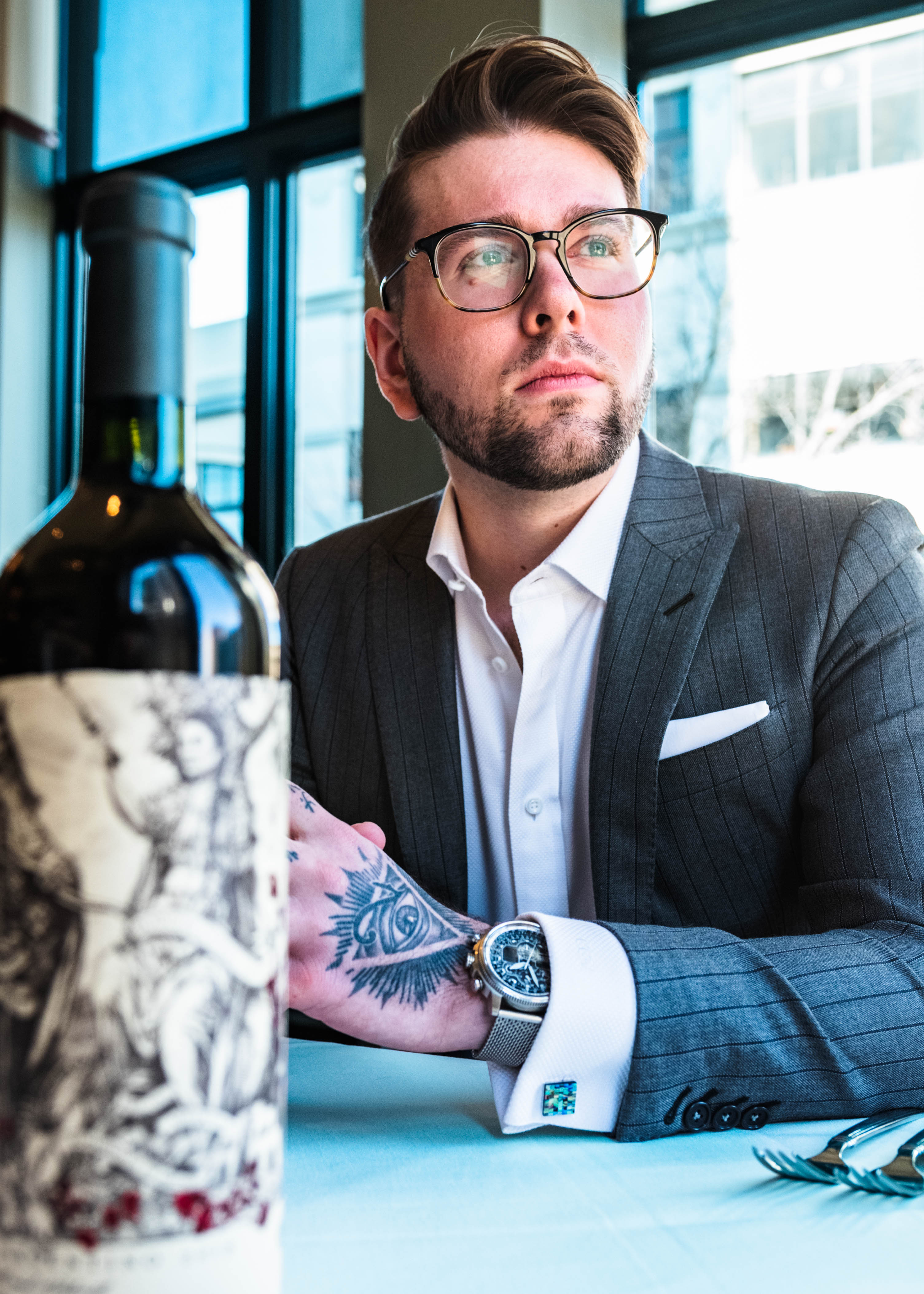 Man wearing custom Fine Line Custom Attire suit & shirt staring to the right.