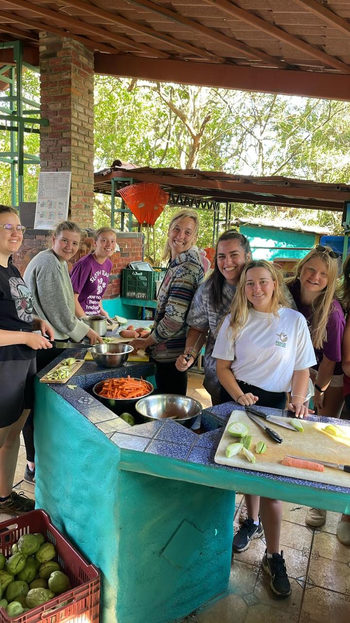 Volunteers preparing food together at Rescue Center Costa Rica