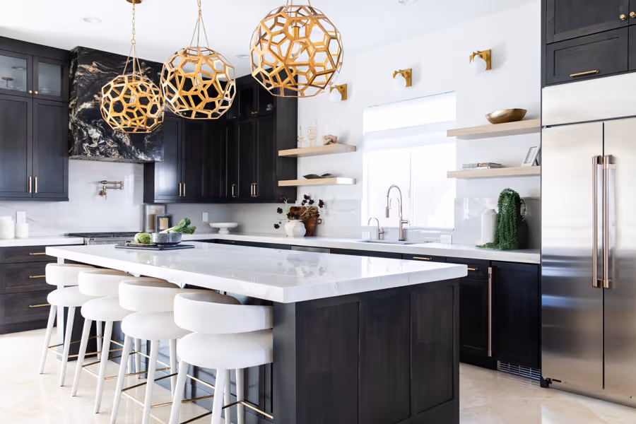 Modern kitchen design in Las Vegas with gold pendants