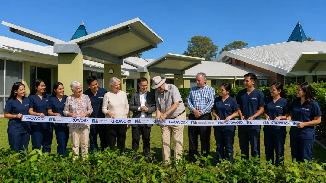 Careforce carers in their uniforms with residents and the provider team at a regional aged care service